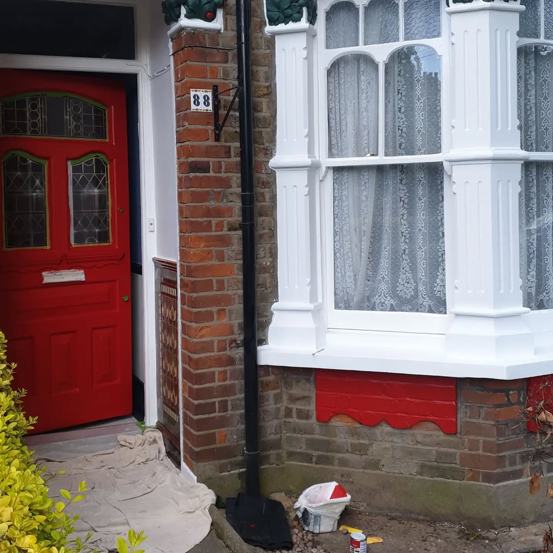 Exterior after — freshly painted Victorian bay window